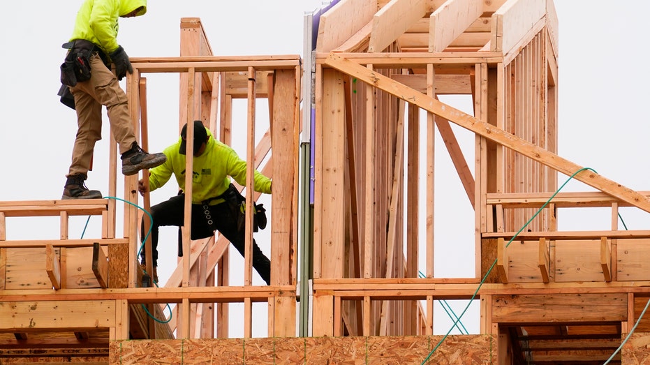 Workers building a home