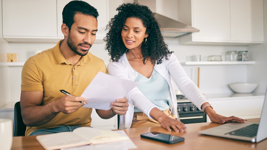 A couple organizing their finances 