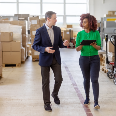 A business owner discusses strategy with an advisor.